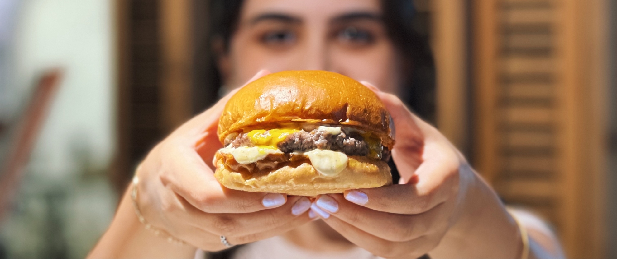 Women holding burger